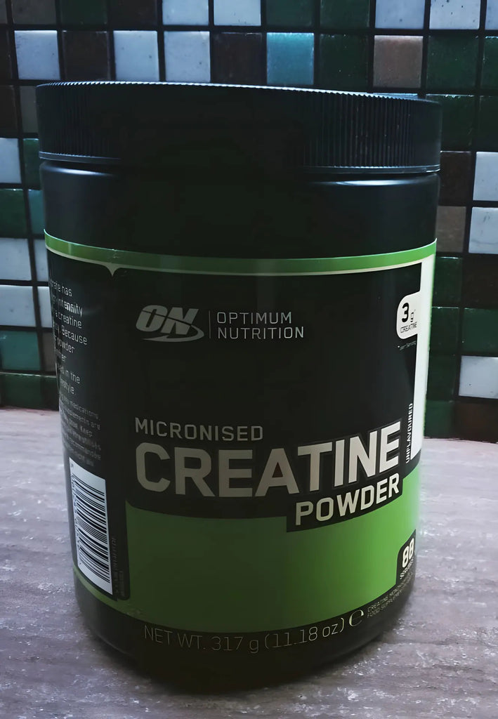 Optimum Nutrition Micronized Creatine Monohydrate Powder in use