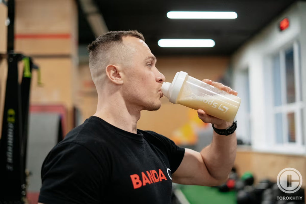 Athlete drinking protein torokhtiy