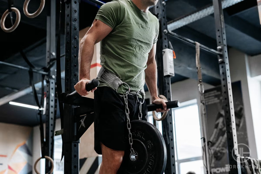 Athlete doing dips with a weighted dip belt