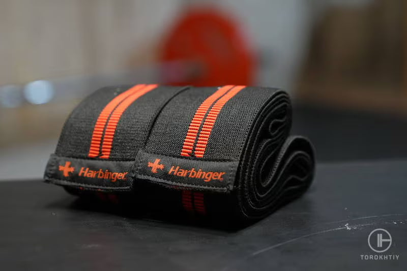 Harbinger Red Line Knee Wraps in use