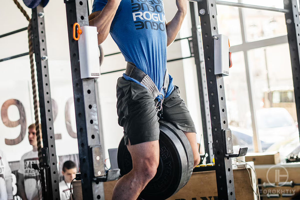 Pull ups with a weighted dip belt workout