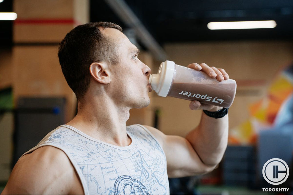 Athlete drinking protein powder with caffeine